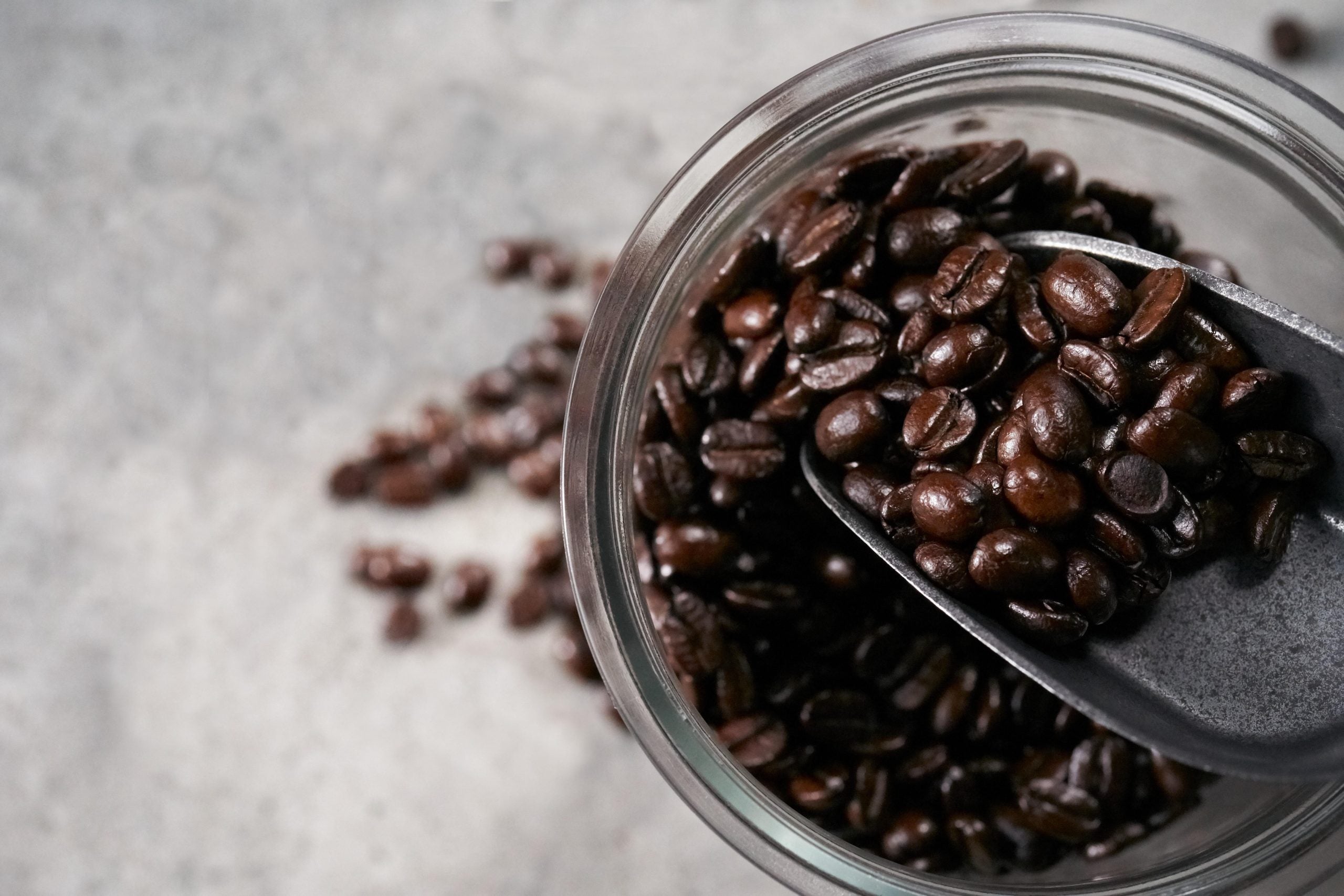 Close up of coffee beans in a scoop 