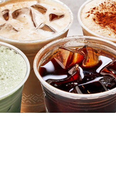 Close up of four iced beverages next to each other on a table