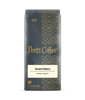 Peet's Coffee Tanzania Peaberry dark roast coffee package on a dark background