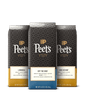 Three Peet's coffee bags with different roast labels on a black background