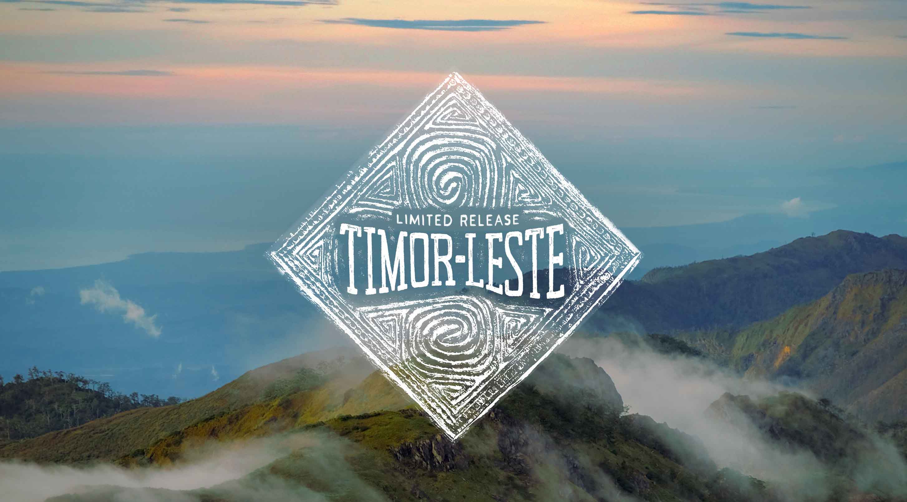 Diamond-shaped logo with 'Timor-Leste' text over a mountainous landscape.